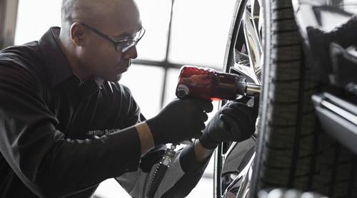Service Technician doing a tire replacement - Rob Green GMC in Twin Falls ID