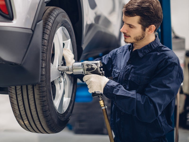 Service Technician installing new tires - Rob Green GMC in Twin Falls ID